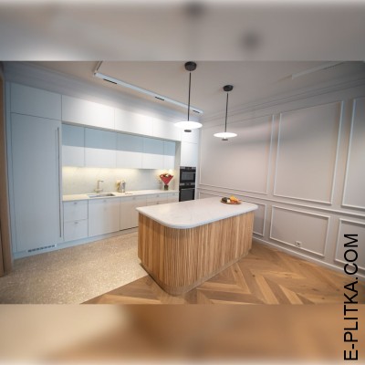 Кухня із стильним округлим островом у рельєфному шпоні