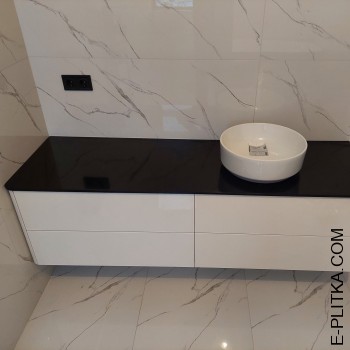 Біла тумба під чорною стільницею з акрилу