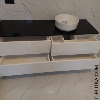 Біла тумба під чорною стільницею з акрилу