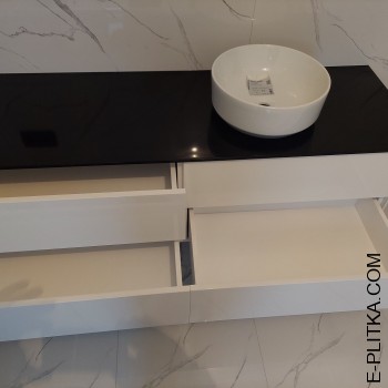 Біла тумба під чорною стільницею з акрилу